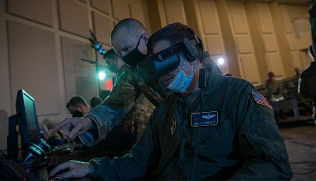 Air Force personnel use virtual reality to conduct a training exercise.