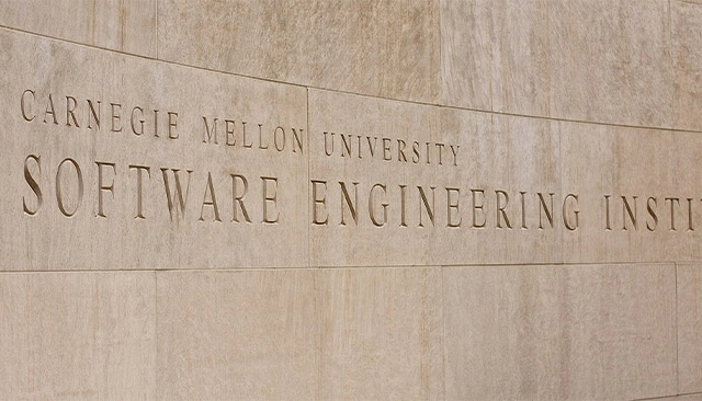 Carnegie Mellon University Software Engineering Institute engraved in stone on the exterior of the SEI building.