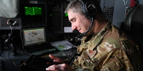 U.S. Airman uses modern computing technology in the field.
