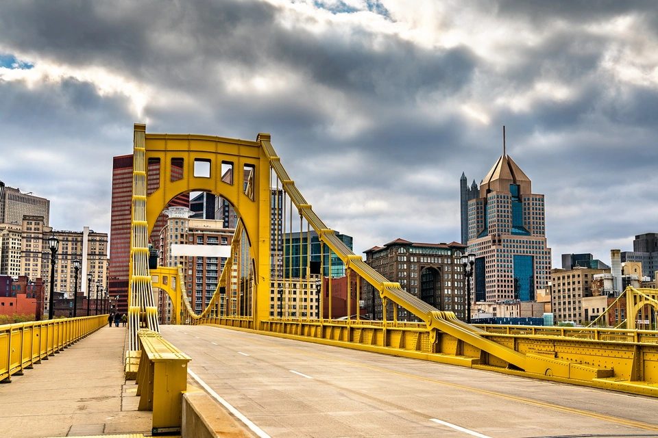 The Andy Warhol bridge stretching across the Allegheny River towards the Downtown Pittsburgh skyline.