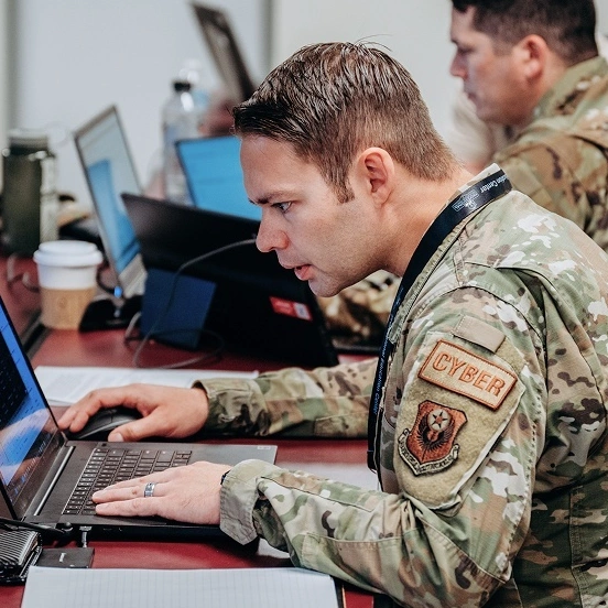 Military personnel participating in a cybersecurity training exercise.