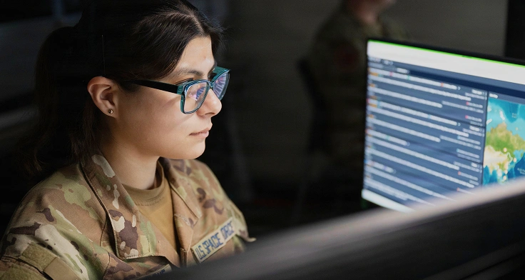 US Space Force guardian working on a desktop computer.
