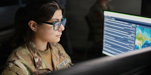 US Space Force guardian working on a desktop computer.
