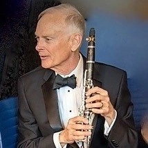 Headshot of Lawrence Jones of ABET, USA with a clarinet.
