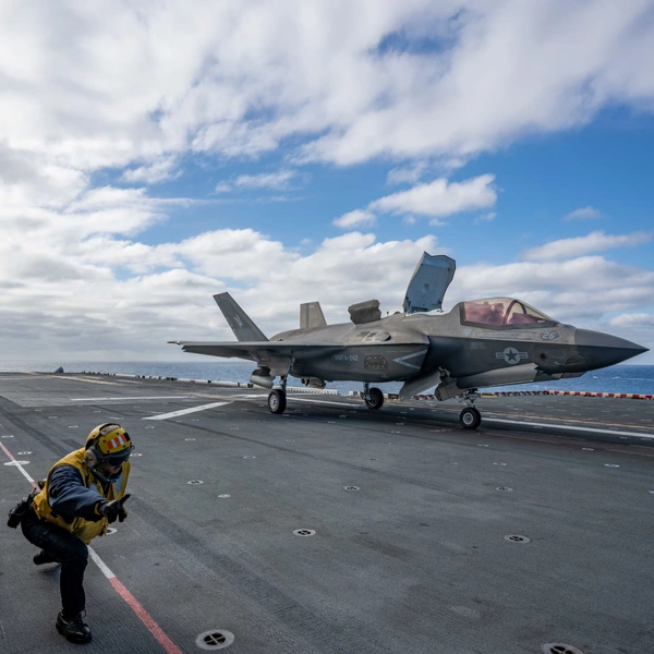 F-35B Lightning II fighter jet prepares for take off from the flight deck of an aircraft carrier.