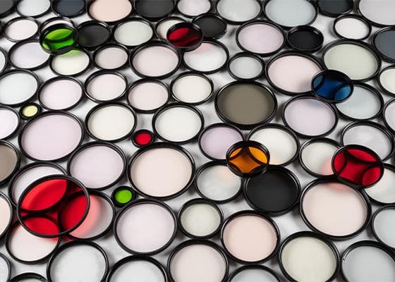 Camera lenses scattered on a table -- Juneberry provide a lens through which to see data.